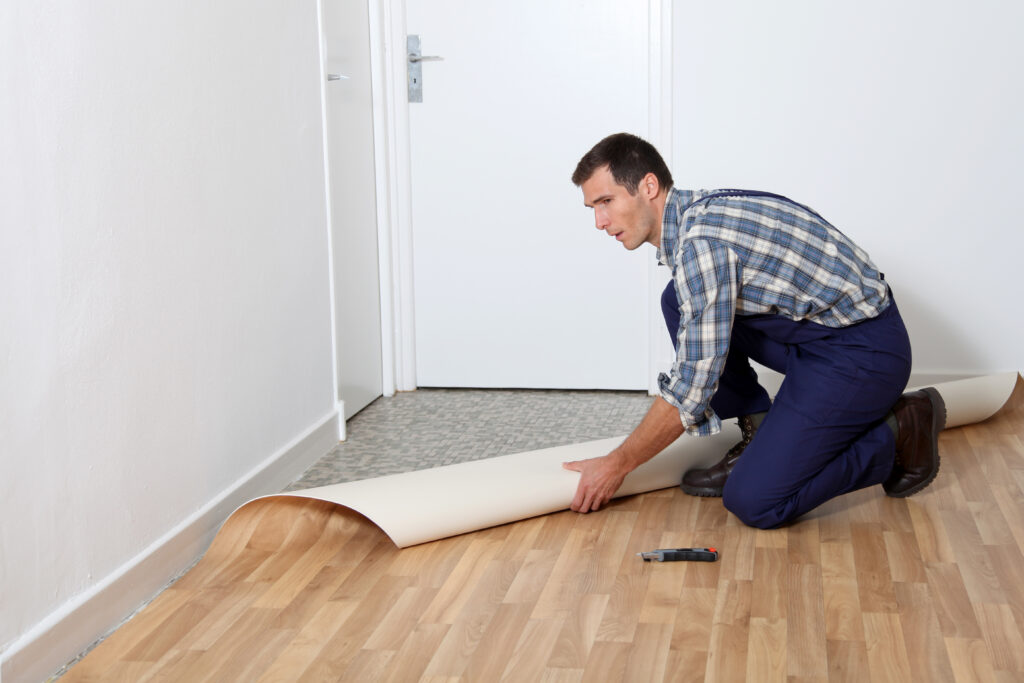 Closeup of artisan installing flooring