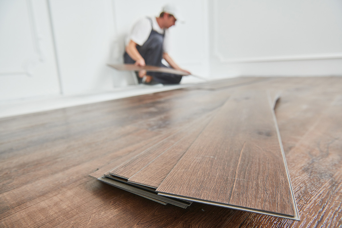 Vinyl plank flooring being installed